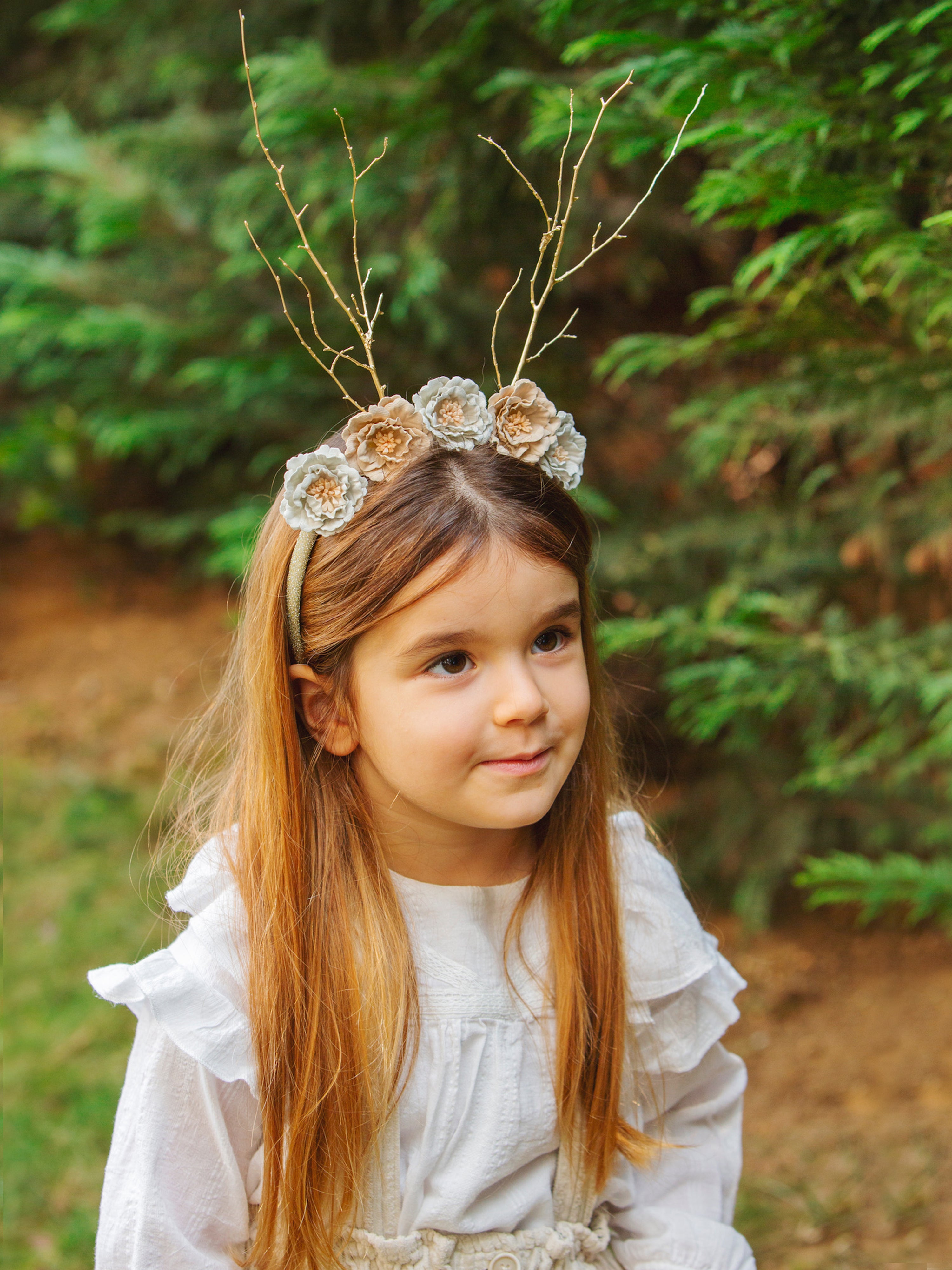 CHILD WITH DEER CROWN